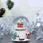 The Christmas Workshop Musical Snow Globe/ 11cm x 10cm x 15cm- new but scruffy/open box
